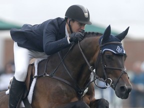 America's Mclain Ward on HH Carlos Z competes during the Suncor Winning Round at Spruce Meadows in Calgary on Friday September 9, 2017. Leah Hennel/Postmedia