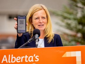 NDP leader Rachel Notley shows off her plan for a vaccine passport at a press conference in Calgary on Thursday, Sept. 2, 2021.