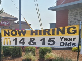Banner in front of Oregon McDonald’s location that reads: ’Now hiring. 14 & 15 year olds’