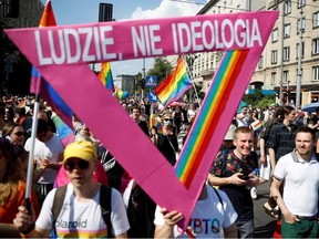 People attend the "Equality Parade" rally in support of the LGBT community, in Warsaw, Poland June 19, 2021. The writing reads: "People, not ideology".