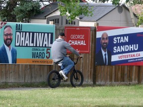 Ward five election signs and federal election signs are seen scattered across Falconridge Blvd. NE. Thursday, September 2, 2021.