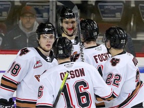 The Calgary Hitmen celebrate a goal  against the Regina Pats at the Saddledome in this photo from Feb. 12, 2020.