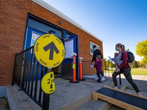 Calgarians vote at the polling station at Sunnyside School on federal election day, Monday, Sept. 20, 2021.