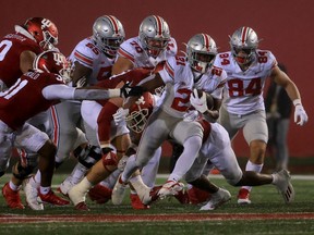 The Ohio State Buckeyes’ Evan Pryor runs the ball against the Indiana Hoosiers at Indiana University at Indiana University Memorial Stadium in Bloomington, Ind., on Saturday, Oct. 23, 2021.