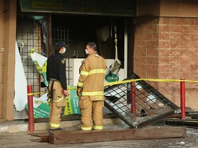 Damage is shown to the front of a medical clinic and pharmacy at a strip mall on Marlborough Dr NE Sunday, October 17, 2021.