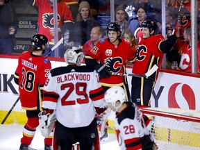 The Calgary Flames’ Derek Ryan scores on New Jersey Devils goaltender Mackenzie Blackwood at the Scotiabank Saddledome in Calgary on Nov. 7, 2019.