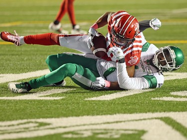 Calgary Stampeders wide receiver Kamar Jorden is tackled by the Saskatchewan Roughriders’ Ed Gainey after a reception during CFL action at McMahon Stadium in Calgary on Saturday, October 23, 2021. Gavin Young/Postmedia