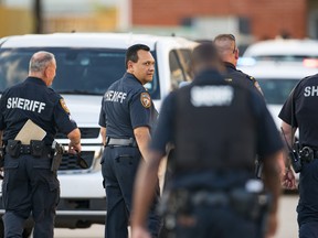 Harris County Sheriff Ed Gonzalez walks back to the scene where, according to Gonzalez, three juveniles were found living alone along with the skeletal remains of another person, possibly a juvenile, in a third floor apartment at the CityParc II at West Oaks Apartments on Sunday, Oct. 24, 2021, at in west Houston.