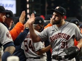 Houston Astros relief pitcher Kendall Graveman celebrates with teammates after defeating the Atlanta Braves in Game 5 of the World Series at Truist Park in Atlanta on Sunday, Oct. 31, 2021.
