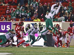 The Saskatchewan Roughriders’ Duke Williams catches a Calgary Stampeders kick at McMahon Stadium in Calgary on Saturday, Oct. 23, 2021.