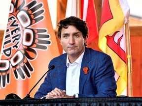 Prime Minister Justin Trudeau speaks to the press and Tk'emlups te Secweepemc community members and First Nations leaders at the Tk'emlups Pow wow Arbour in British Columbia, Oct. 18, 2021.