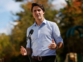 Prime Minister Justin Trudeau speaks to media after visiting a vaccination clinic in Ottawa, Ontario, Canada September 28, 2021.