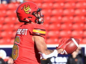 The Calgary Dinos’ Tyson Philpot catches a pass before running for a touchdown against the UBC Thunderbirds at McMahon Stadium in Calgary on Saturday, Oct. 30, 2021.