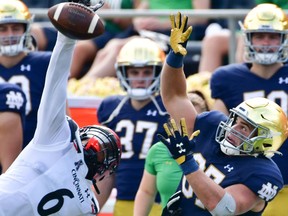 Oct 2, 2021; South Bend, Indiana, USA; Cincinnati Bearcats safety Bryan Cook (6) breaks up a pass intended for Notre Dame Fighting Irish tight end Michael Mayer (87) in the second quarter at Notre Dame Stadium. Mandatory Credit: Matt Cashore-USA TODAY Sports