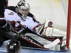Calgary Hitmen goaltender Brayden Peters makes a save against the Red Deer Rebels 3-2 at the Saddledome in Calgary on Sunday, Oct. 31, 2021.