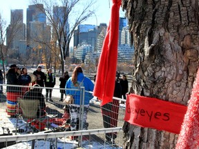 Earlier this week ribbons honouring the lives of missing and murdered Indigenous women and girls had been cut off trees near the Field of Crosses and found in the garbage. Saturday a ceremony was held to rehang hundreds of red ribbons.