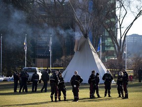 While most of the camp protesting COVID-19 vaccinations, Indigenous injustices have been removed from Alberta legislature grounds a few teepees remain with a large police presence staying close by on Monday, Oct. 25, 2021 in Edmonton.
