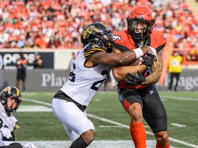 The Calgary Stampeders’ Reggie Begelton runs with the ball against the Hamilton Tiger-Cats at McMahon Stadium in Calgary on Sept. 14, 2019.