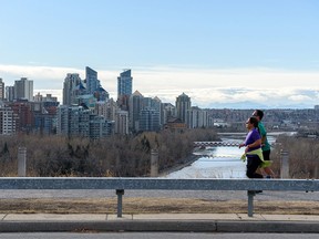 People Spend An Afternoon On Their Way To Crescent Heights With A View Of The Calgary Skyline In The Background On Thursday, November 25, 2021.