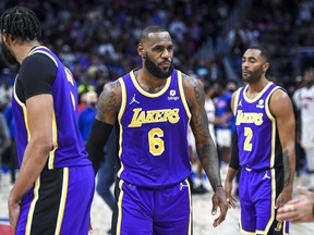 LeBron James of the Los Angeles Lakers looks on as he is ejected from the game during the third quarter of the game against the Detroit Pistons at Little Caesars Arena on November 21, 2021 in Detroit, Michigan.