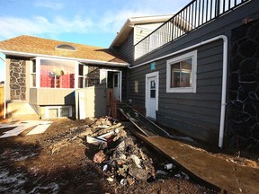 Damage is shown at a house on Whiteram Court N.E. in Calgary on Sunday, November 28, 2021. Fire officials say nine people in the home at the time were able to escape the blaze. One man was taken to hospital with minor chest pains.
