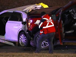 Calgary police investigate a double fatal car crash on Macleod Trail between Lake Fraser Drive and Canyon Meadows Dr. in Calgary on Wednesday, November 24, 2021.