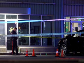 Calgary police investigate after a man was shot and killed in a parking lot at a strip mall on 28 St. and 2nd Ave. S.E. in Calgary on Monday, November 22, 2021.