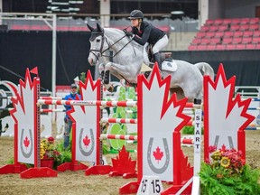 Alicia Gadban-Lewis rides to victory in the Truman Homes Cup during the Canadian Show Jumping Championships at the Nutrien Western Event Centre in Calgary on Saturday, Nov. 6, 2021.
