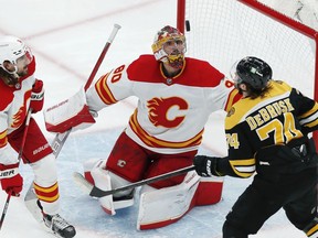 The Boston Bruins’ Jake DeBrusk looks for the rebound off Calgary Flames goaltender Daniel Vladar at TD Garden in Boston on Sunday, Nov. 21, 2021.