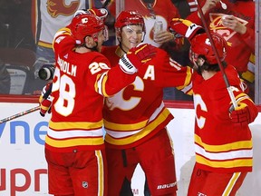 The Calgary Flames’ Matthew Tkachuk celebrates after scoring the game-winner against the Chicago Blackhawks goalie Marc-Andre Fleury at the Scotiabank Saddledome in Calgary on Tuesday, Nov. 23, 2021.