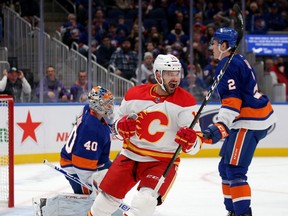 Flames winger Brad Richardson celebrates his goal against goaltender Semyon Varlamov and the New York Islanders during Saturday's game at UBS Arena.