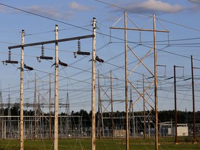 In this photo from May 28, 2019, power lines converge on a Central Maine Power substation in Pownal, Maine. The company's controversial 145-mile, billion-dollar power line would bring hydro-electricity from Canada into the regional grid, to serve New England customers.