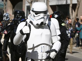 A StormTrooper gives a thumbs up during the annual Parade of Wonders that kicks off the 2019 Calgary Comic Expo Friday, April 26, 2019. Dean Pilling/Postmedia