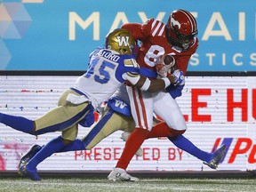 The Calgary Stampeders’ Luther Hakunavanhu mades a touchdown catch against the Winnipeg Blue Bombers at McMahon Stadium in Calgary on Saturday, Nov. 20, 2021.