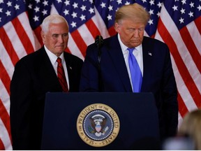 U.S. President Donald Trump and Vice-President Mike Pence stand while making remarks about early results from the 2020 U.S. presidential election in the East Room of the White House in Washington, D.C., Nov. 4, 2020.