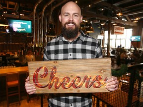 Andrew Gordon, general manager at CRAFT Beer Market on 10 Ave SW poses Thursday, December 30, 2021.