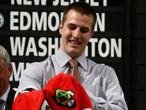 Kyle Beach dons his Blackhawks jersey after being selected at the 2008 NHL entry draft.