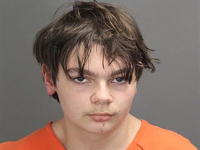 Police booking photo of Ethan Crumbley, 15, accused of shooting four fellow students to death at his high school in Michigan on Dec. 2, 2021. His parents have been charged with involuntary manslaughter.