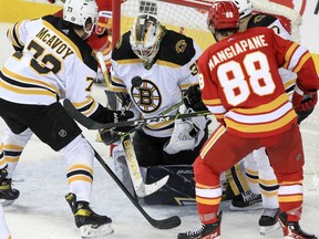 Boston Bruins goaltender Linus Ullmark makes a save against the Calgary Flames at Scotiabank Saddledome on Saturday, Dec. 11, 2021.