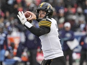 Hamilton Tiger-Cats quarterback Dane Evans (9) goes to throw a pass against the Toronto Argonauts during the first half of the Canadian Football League Eastern Conference Final game at BMO Field.
