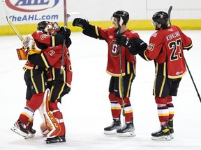 With Wednesday’s 2-1 shootout victory, the American Hockey League’s Stockton Heat — the top affiliate for the Calgary Flames — improved to 16-2-3 on the season. From left, Flames prospects Jakob Pelletier, Dustin Wolf, Glenn Gawdin and Justin Kirkland celebrate their latest W.