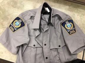 A peace officer's uniform seized in Calgary during the execution of a search warrant in relation to a string of jewelry store thefts.