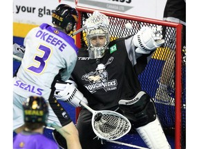 Calgary Roughnecks goalie Christian Del Bianco makes a save on the San Diego Seals’ Mac O’Keefe at WestJet Field at the Scotiabank Saddledome on Friday, Dec. 17, 2021.