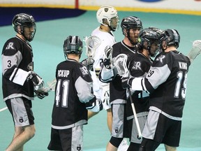 The Calgary Roughnecks celebrate after scoring a goal against the Vancouver Warriors during pre-season action at WestJet Field in the Scotiabank Saddledome Friday, Nov. 26, 2021.