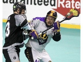 Dane Dobbie, now a member of the San Diego Seals, makes his return to the Scotiabank Saddledome while being hit by the Calgary Roughnecks’ Liam LeClair on Friday, Dec. 17, 2021.
