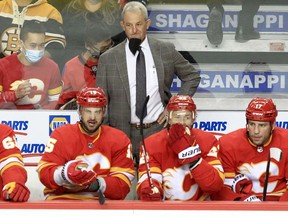 Calgary Flames head coach Darryl Sutter mans the bench.