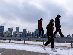 Pedestrians go for a walk along the pathway at Crescent Heights on a cold afternoon on Tuesday, January 18, 2022.