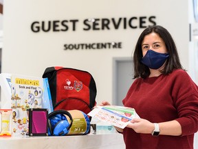 Alexandra Velosa, Southcentre Mall marketing manager, poses for a photo with some of the goods included in the backpacks that are filled with resources for kids with sensory disabilities at the shopping centre on Wednesday, January 19, 2022. The backpacks are available for rent at the guest services at the Mall.