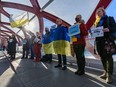 Participants in a rally organized by Calgary's Ukrainian Canadian Congress show solidarity with the Ukrainian people on the Peace Bridge on Saturday, January 22, 2022. Azin Ghaffari/Postmedia