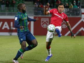 Cavalry FC’s Jose Escalante gets a touch in front of a York defender at ATCO Field at Spruce Meadows on Oct. 14, 2021.